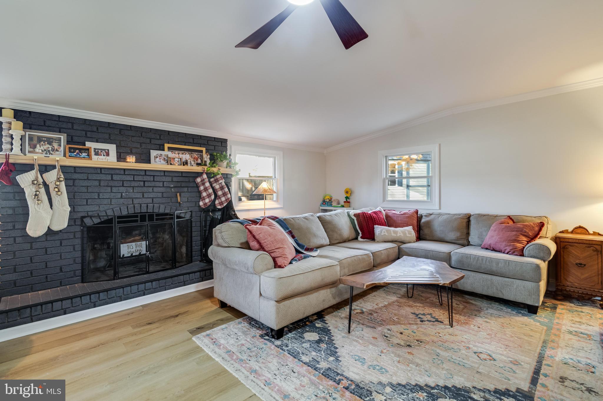 40905 Spring House Lane Leonardtown, MD 20650 - Photo 17 of 50 a living room with furniture and a fireplace