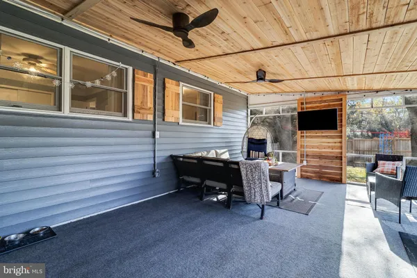a view of a porch with furniture