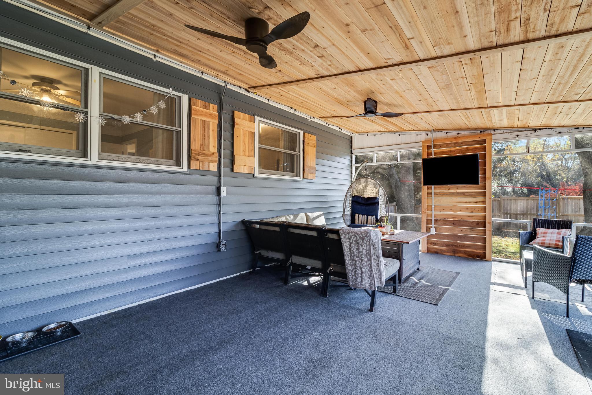 40905 Spring House Lane Leonardtown, MD 20650 - Photo 30 of 50 a view of a porch with furniture