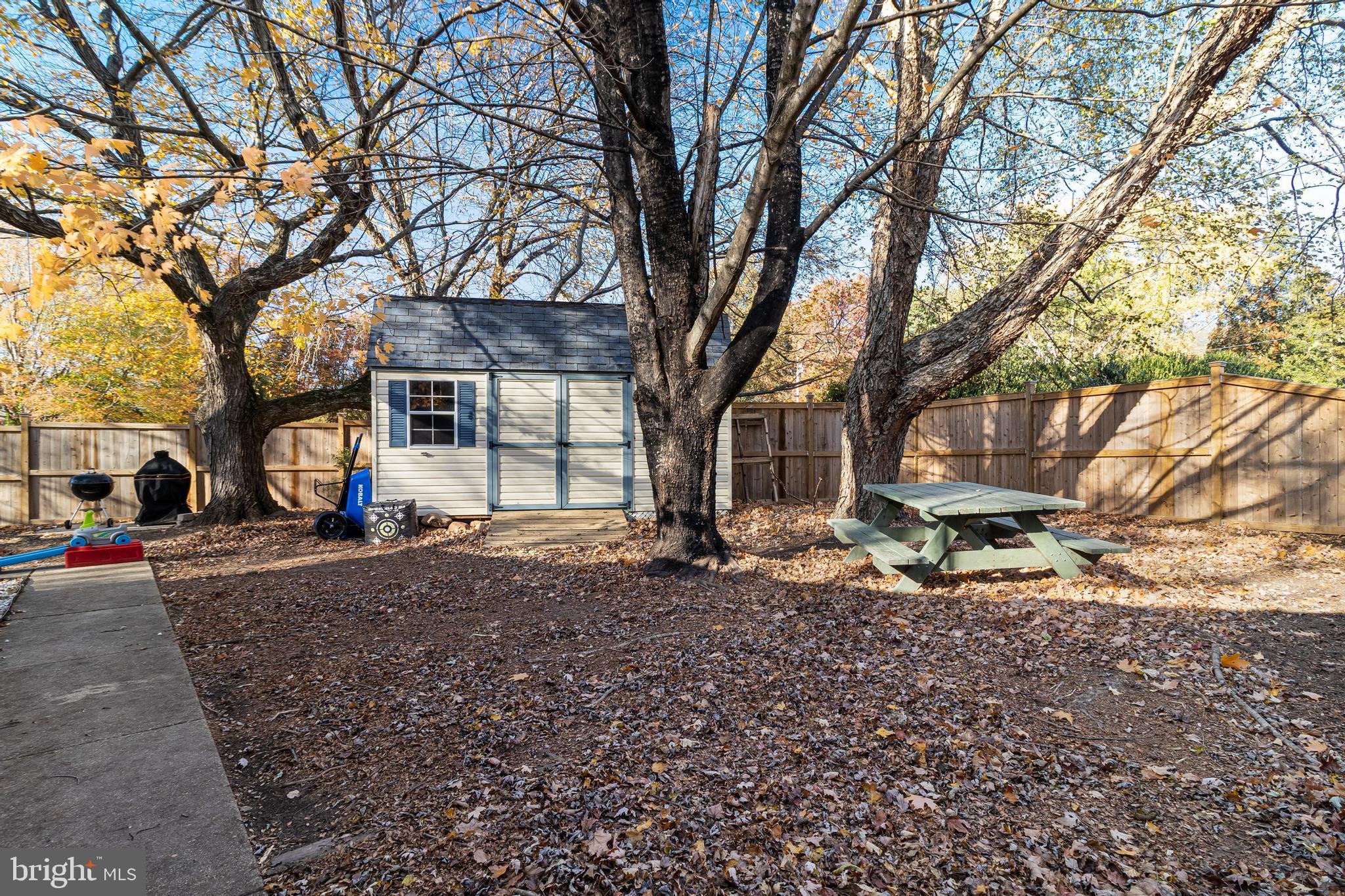 40905 Spring House Lane Leonardtown, MD 20650 - Photo 33 of 50 a view of a house with a yard covered in snow
