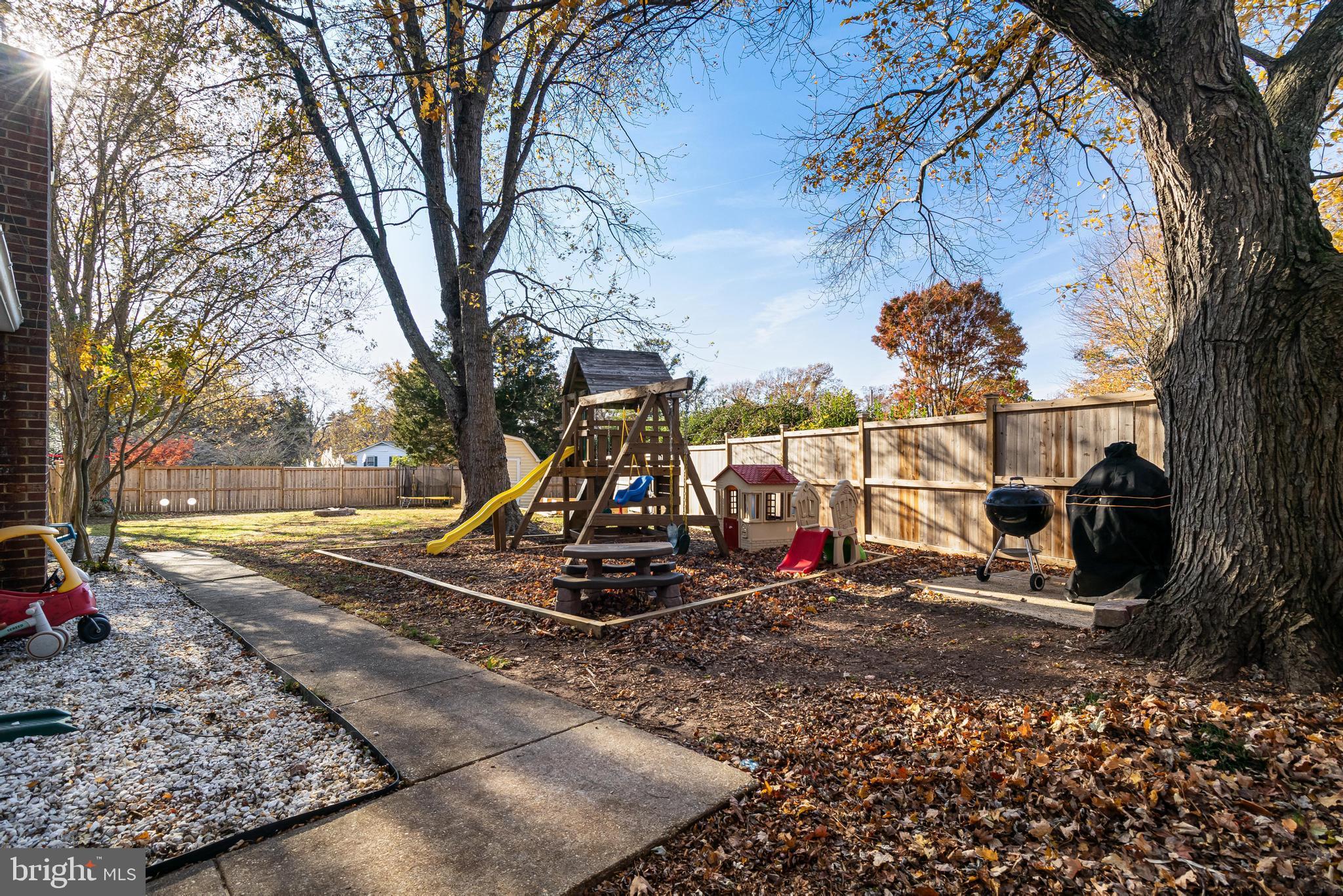 40905 Spring House Lane Leonardtown, MD 20650 - Photo 34 of 50 a view of a yard with a tree