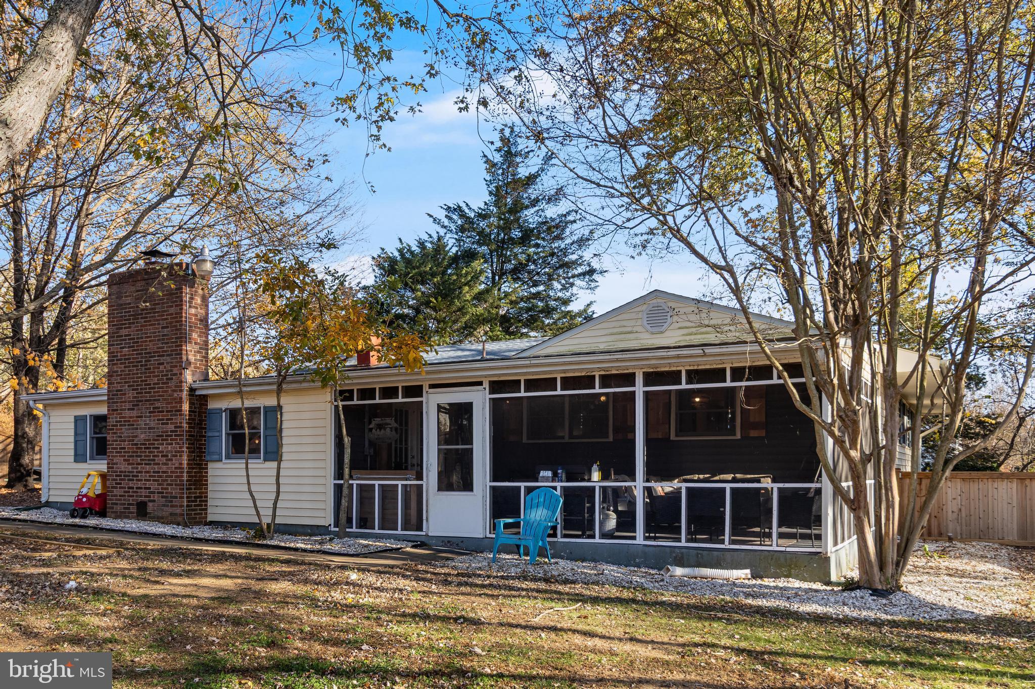 40905 Spring House Lane Leonardtown, MD 20650 - Photo 36 of 50 a view of a house with a large window and large tree