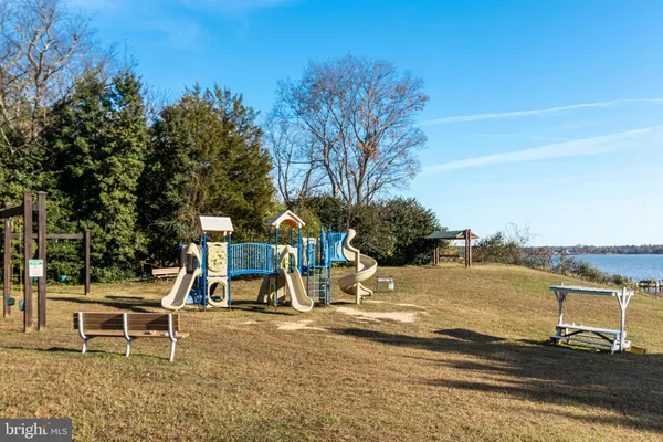 a chair and table sitting in the ocean