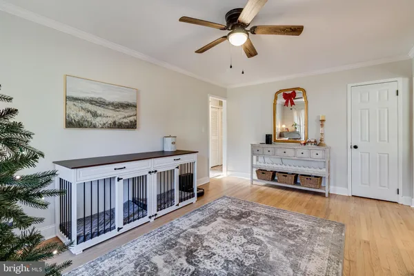 wooden floor with a chandelier in a room