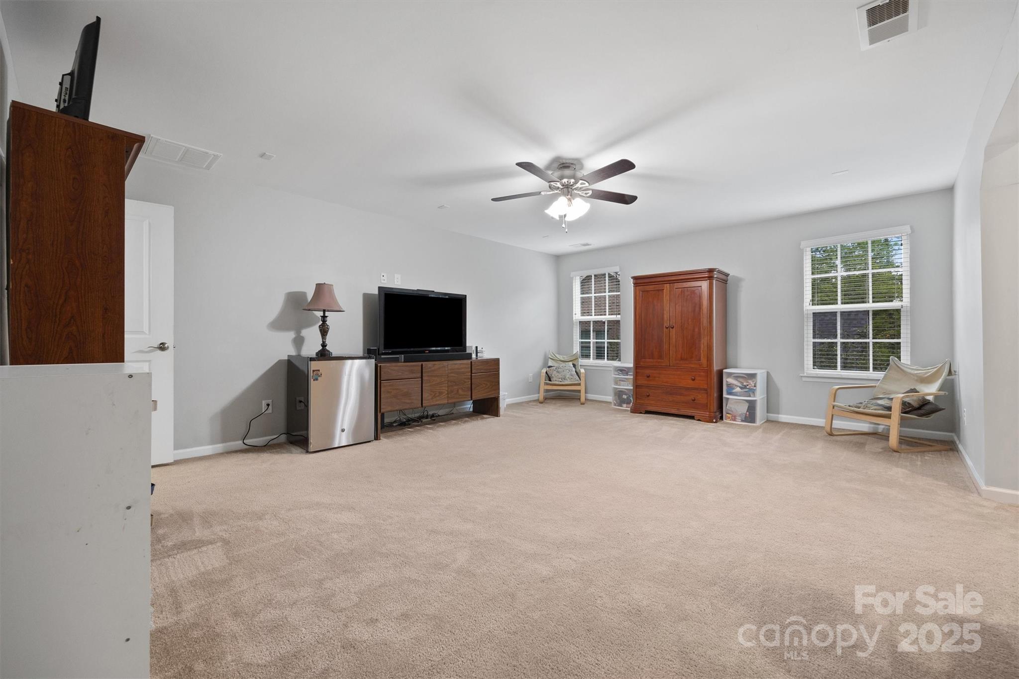 4237 Little Fork Cove Road Denver, NC 28037 - Photo 18 of 38 a living room with furniture and a flat screen tv