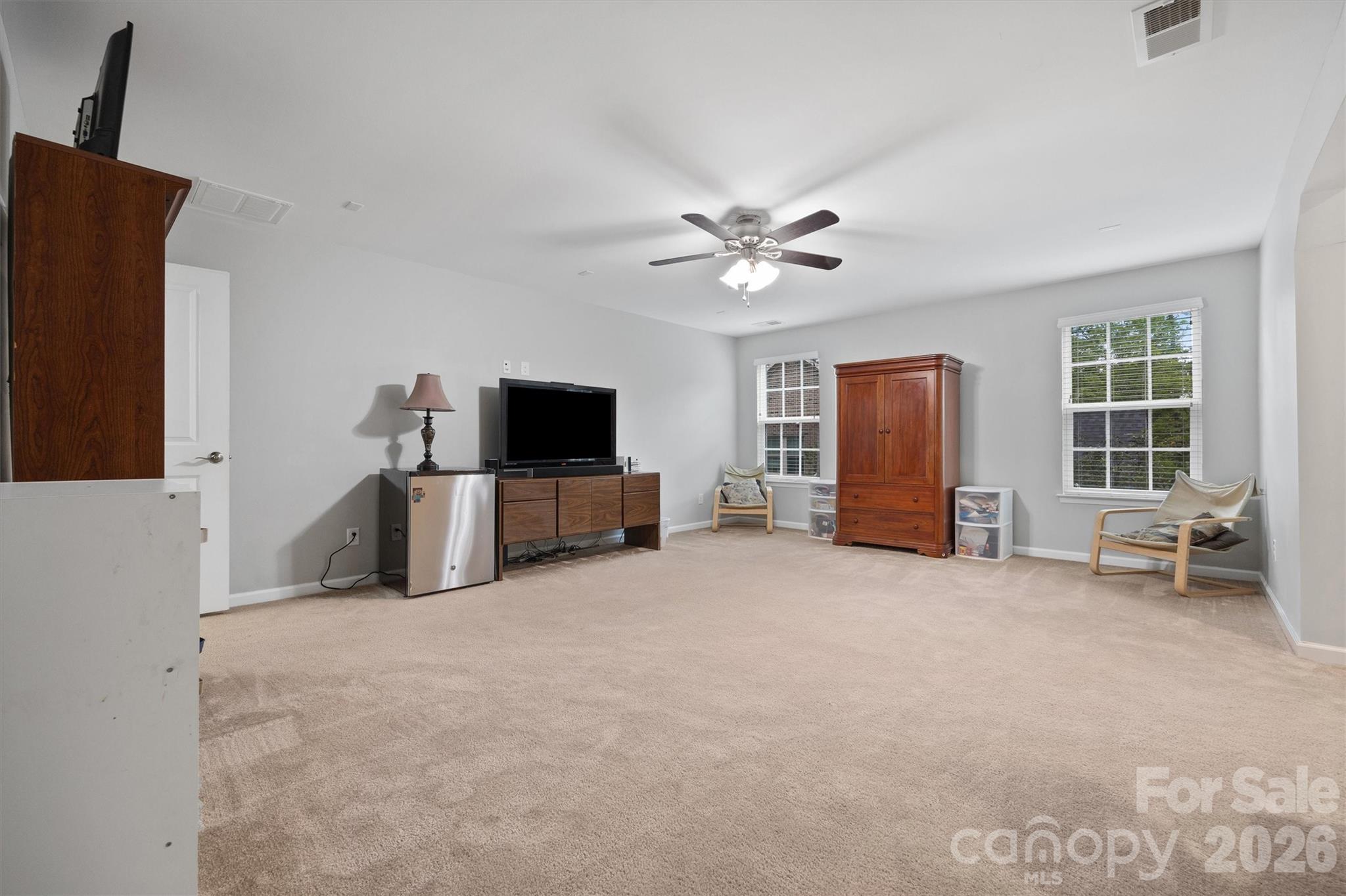 4237 Little Fork Cove Road Denver, NC 28037 - Photo 19 of 40 a living room with furniture and a flat screen tv