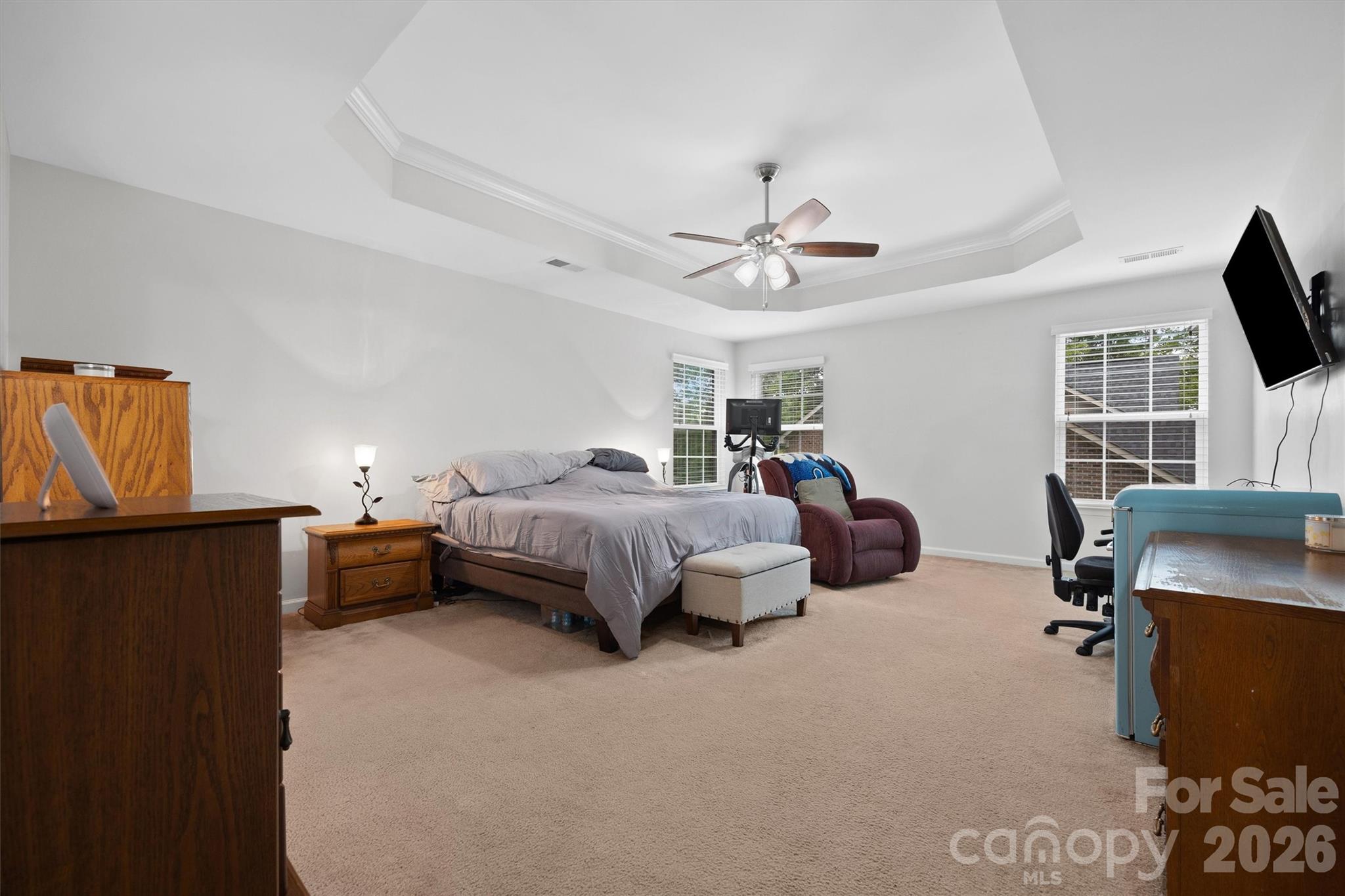 4237 Little Fork Cove Road Denver, NC 28037 - Photo 20 of 40 a spacious bedroom with a bed furniture and a flat screen tv