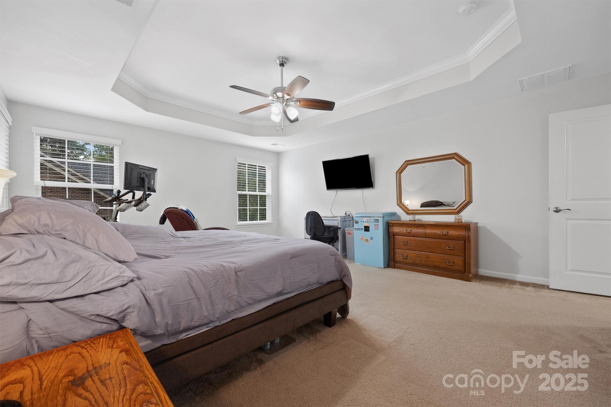 4237 Little Fork Cove Road Denver, NC 28037 - Photo 21 of 38 a bedroom with a bed and a flat screen tv