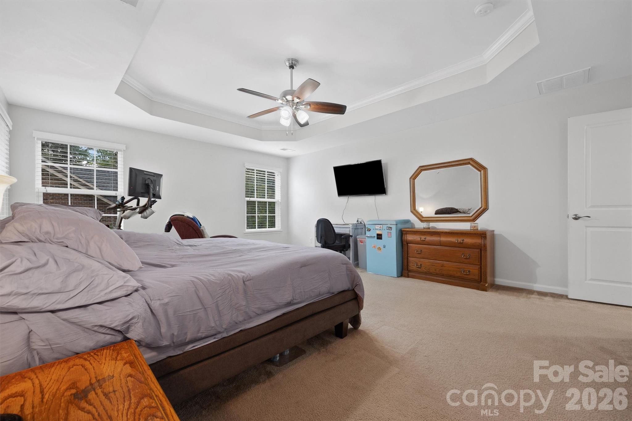 4237 Little Fork Cove Road Denver, NC 28037 - Photo 22 of 40 a bedroom with a bed and a flat screen tv