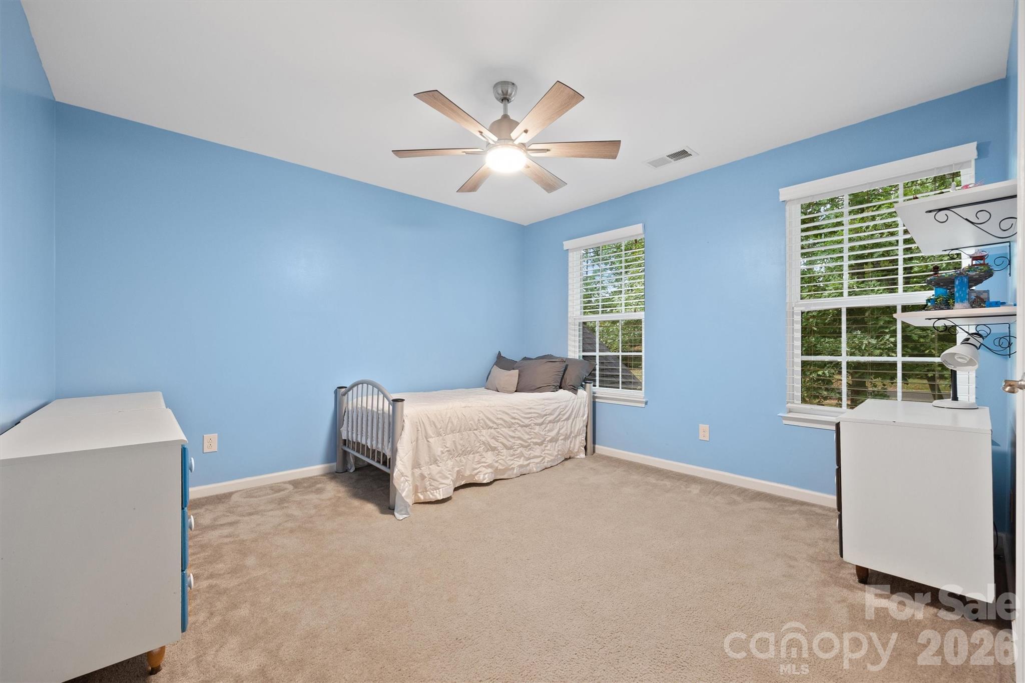 4237 Little Fork Cove Road Denver, NC 28037 - Photo 26 of 40 a bedroom with a bed and a window