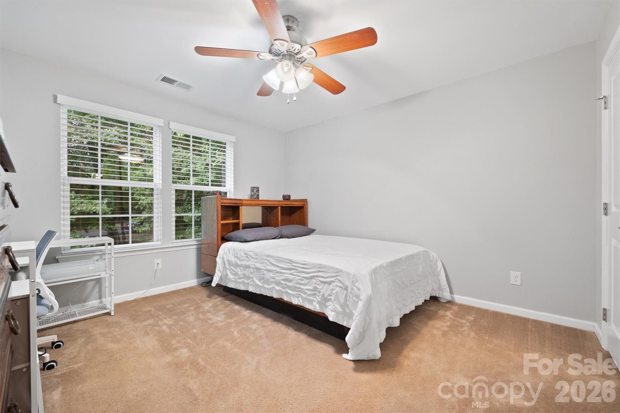 4237 Little Fork Cove Road Denver, NC 28037 - Photo 27 of 40 a bedroom with a bed and a large window