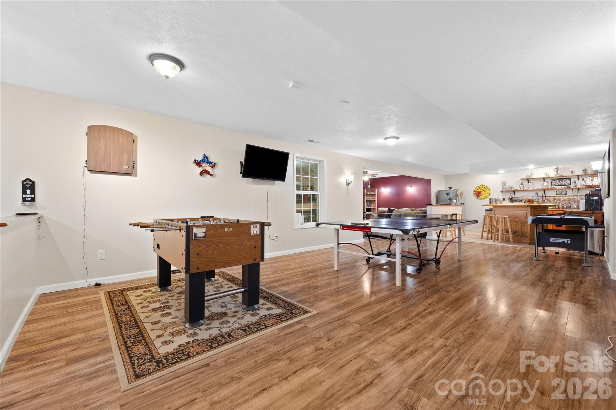 4237 Little Fork Cove Road Denver, NC 28037 - Photo 30 of 40 a living room with furniture and a wooden floor
