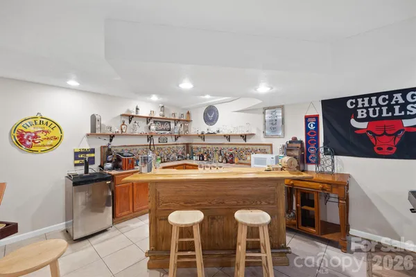 a large kitchen with a table and chairs