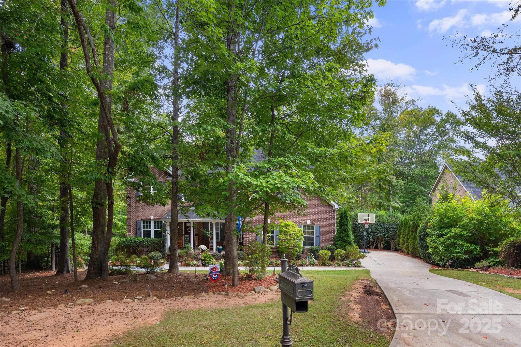 4237 Little Fork Cove Road Denver, NC 28037 - Photo 38 of 38 a front view of a house with garden