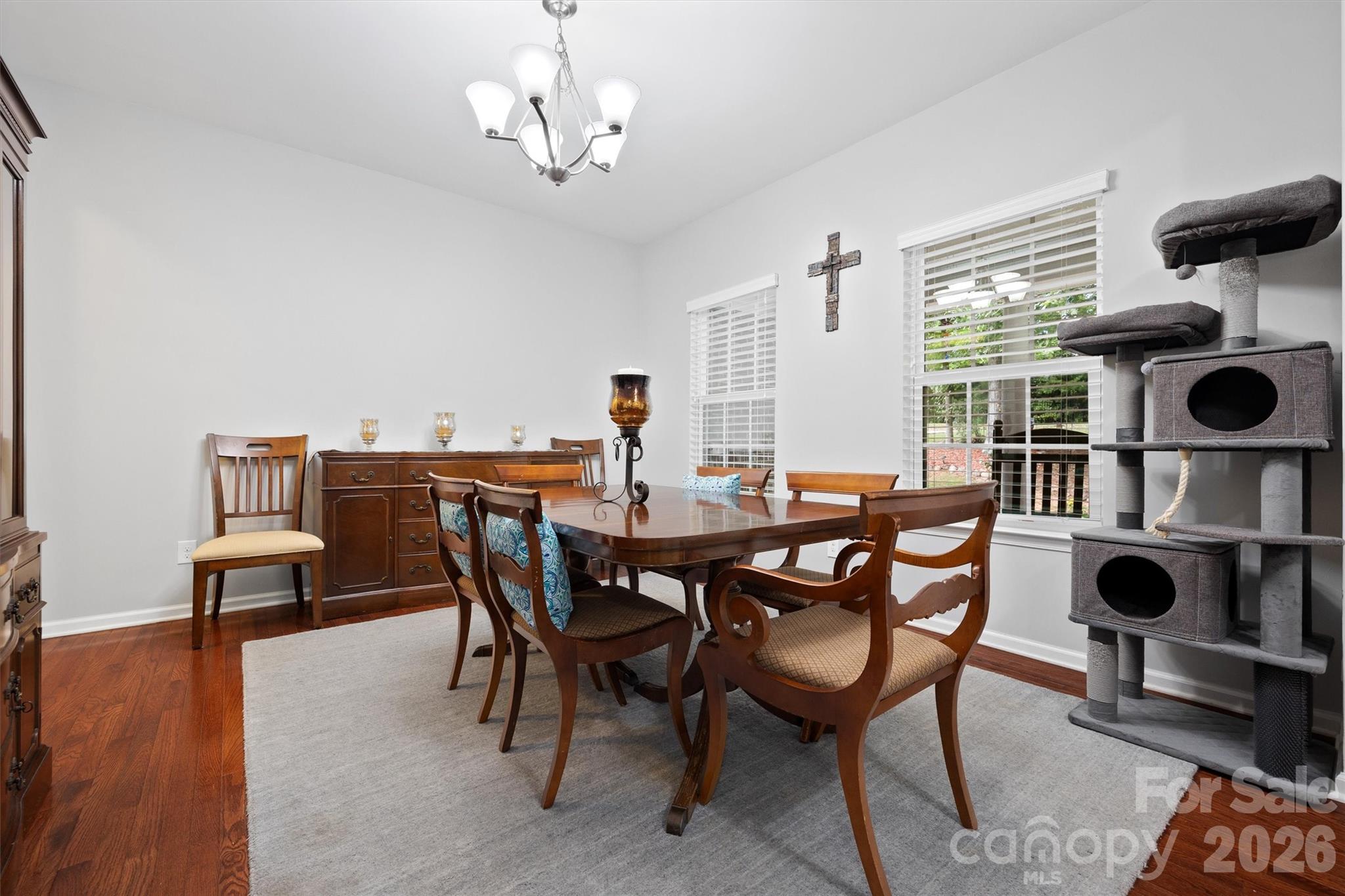 4237 Little Fork Cove Road Denver, NC 28037 - Photo 5 of 40 a view of a dining room with furniture and chandelier