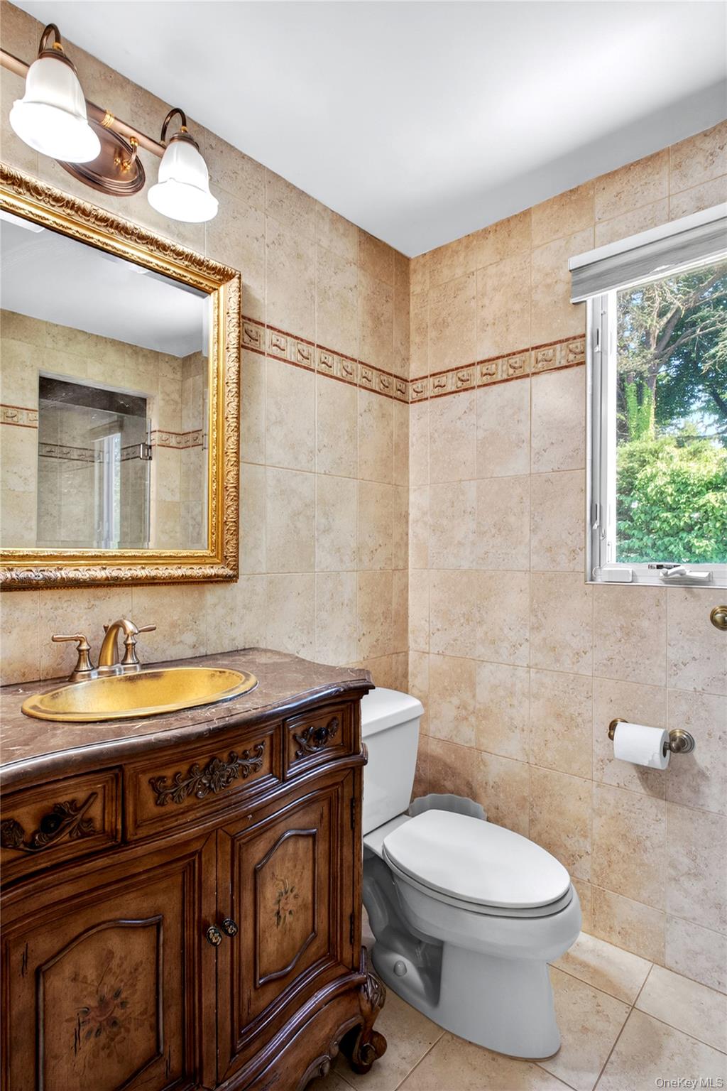 60 Mill Spring Road Manhasset, NY 11030 - Photo 13 of 18 a bathroom with a sink a toilet and a mirror
