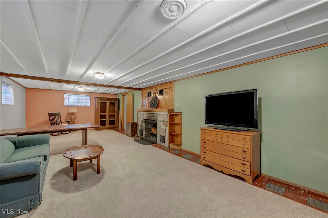 25915 Kennedy Ridge Road North Olmsted, OH 44070 - Photo 30 of 48 Carpeted living room with a fireplace with flush hearth and baseboards