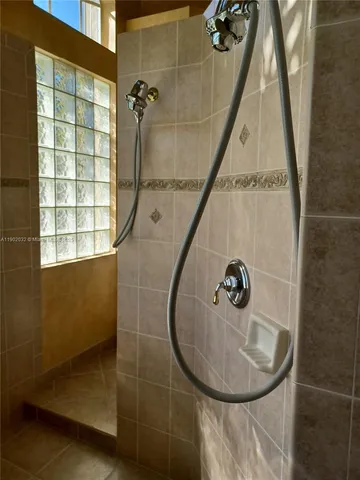 a bathroom with a sink and shower
