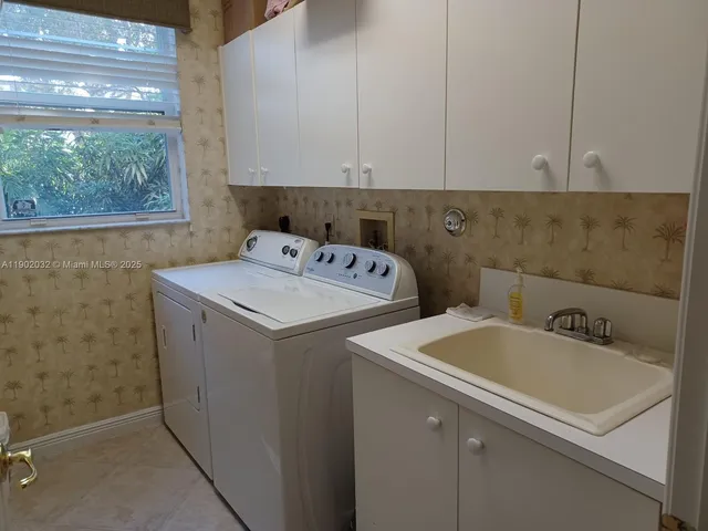 a utility room with dryer and washer