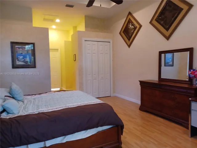 a bedroom with a bed and a dresser