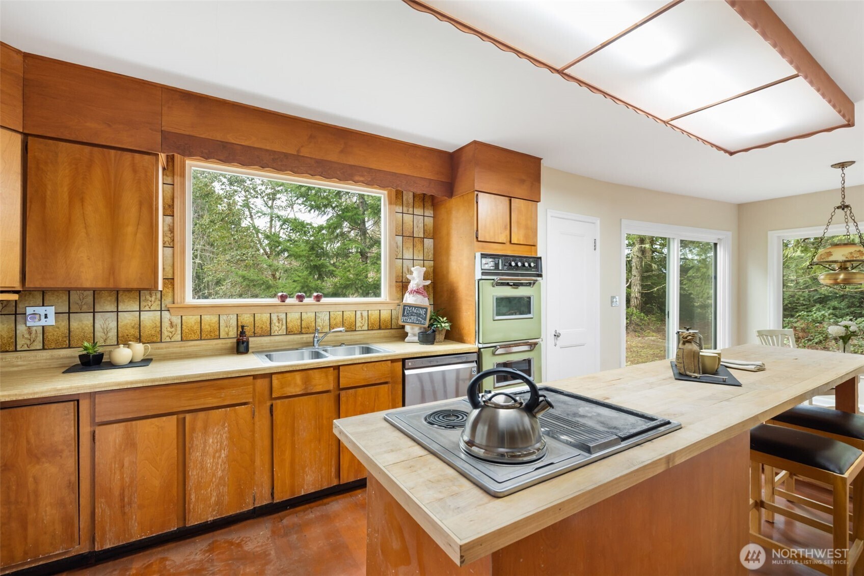9520 Dishman Road Northwest Bremerton, WA 98312 - Photo 14 of 38 a kitchen with a sink and a large window