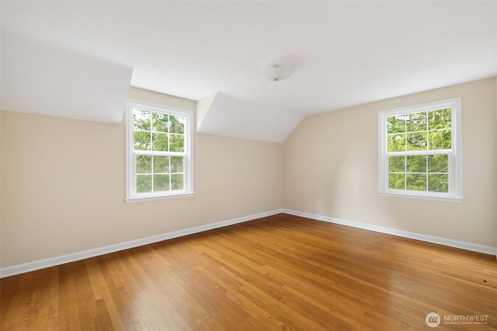 9520 Dishman Road Northwest Bremerton, WA 98312 - Photo 20 of 38 an empty room with wooden floor and windows