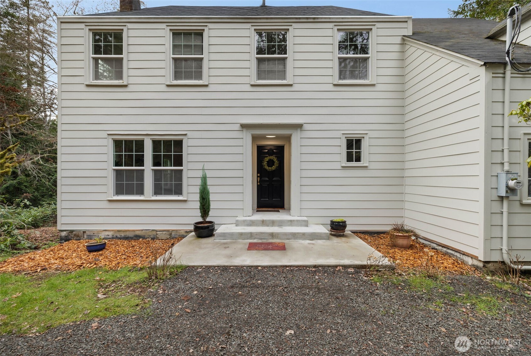 9520 Dishman Road Northwest Bremerton, WA 98312 - Photo 4 of 38 a front view of a house with garage