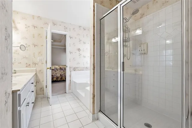 a bathroom with a granite countertop shower mirror and a sink