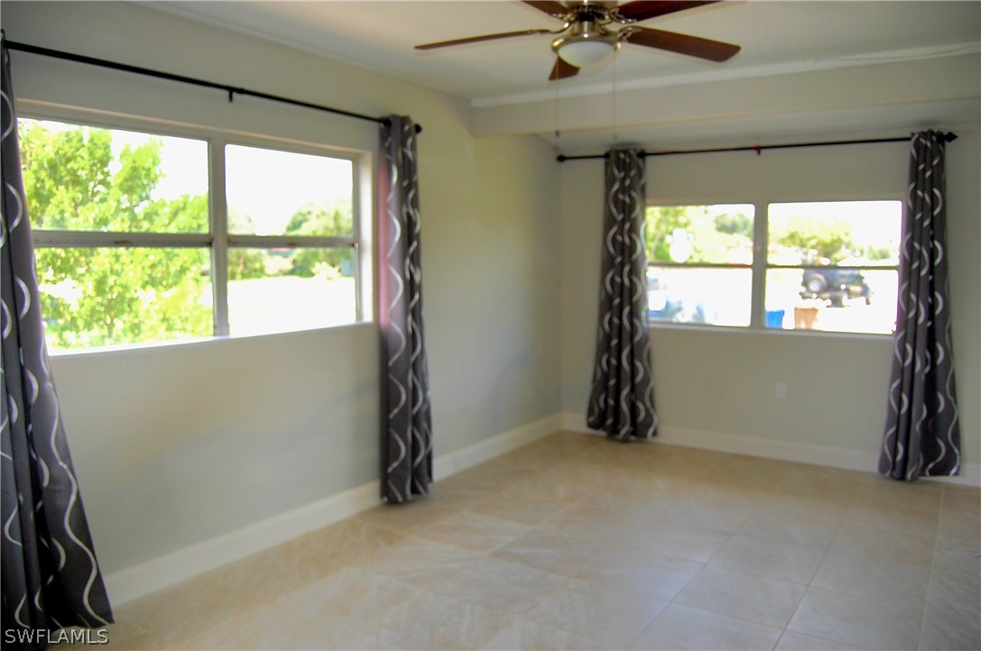 200 Oregon Road West Lehigh Acres, FL 33936 - Photo 5 of 18 an empty room with a window