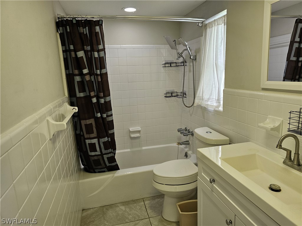 200 Oregon Road West Lehigh Acres, FL 33936 - Photo 7 of 18 a bathroom with a sink toilet and shower
