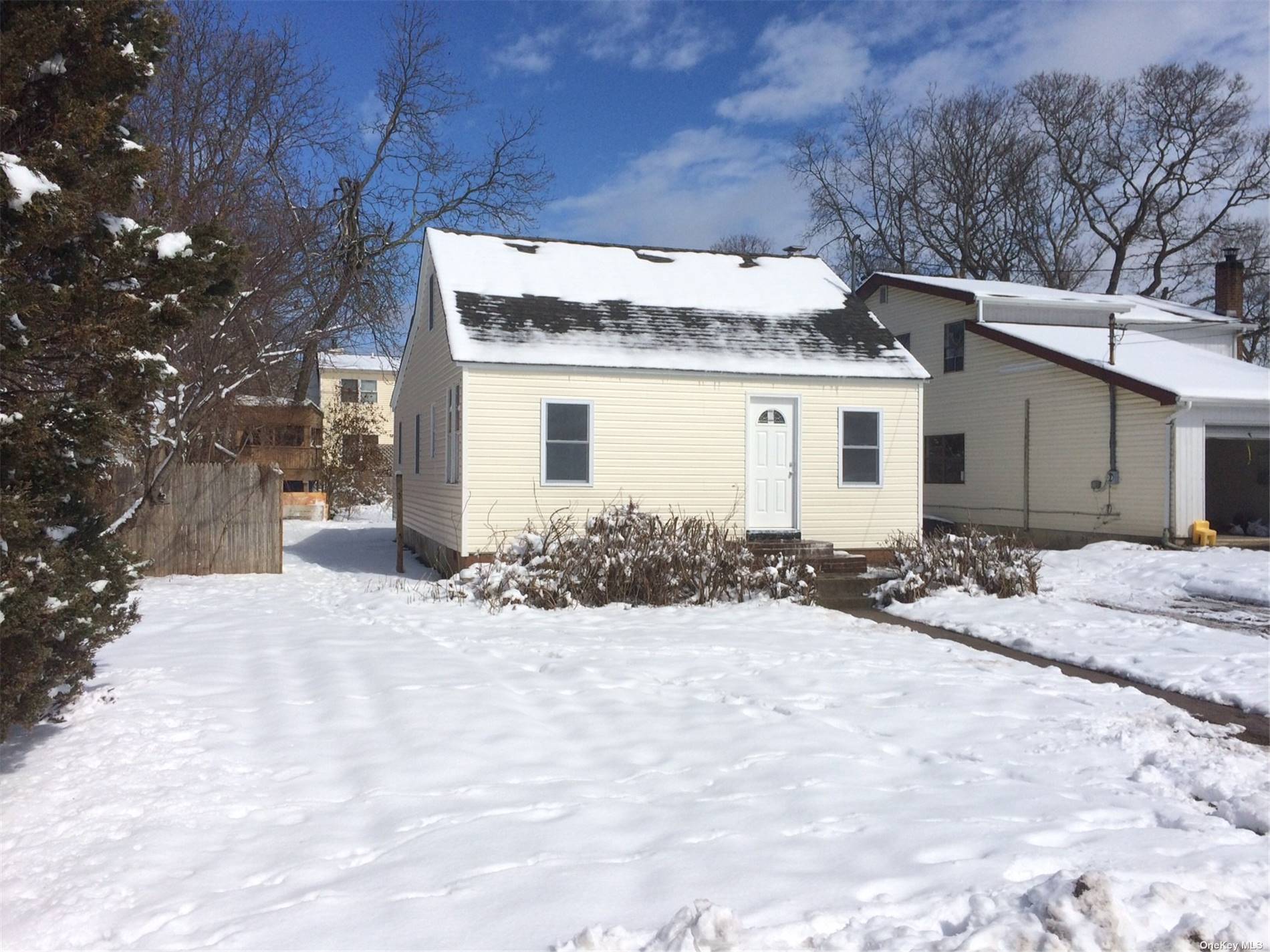 a view of a house with a snow in the yard