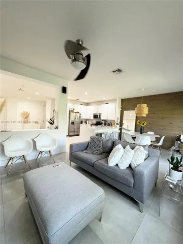 a kitchen with a sink and a mirror