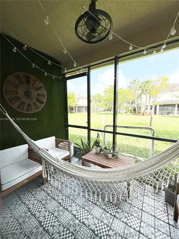 a utility room with cabinets washer and dryer