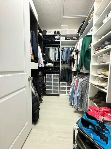 a view of a swimming pool with chairs