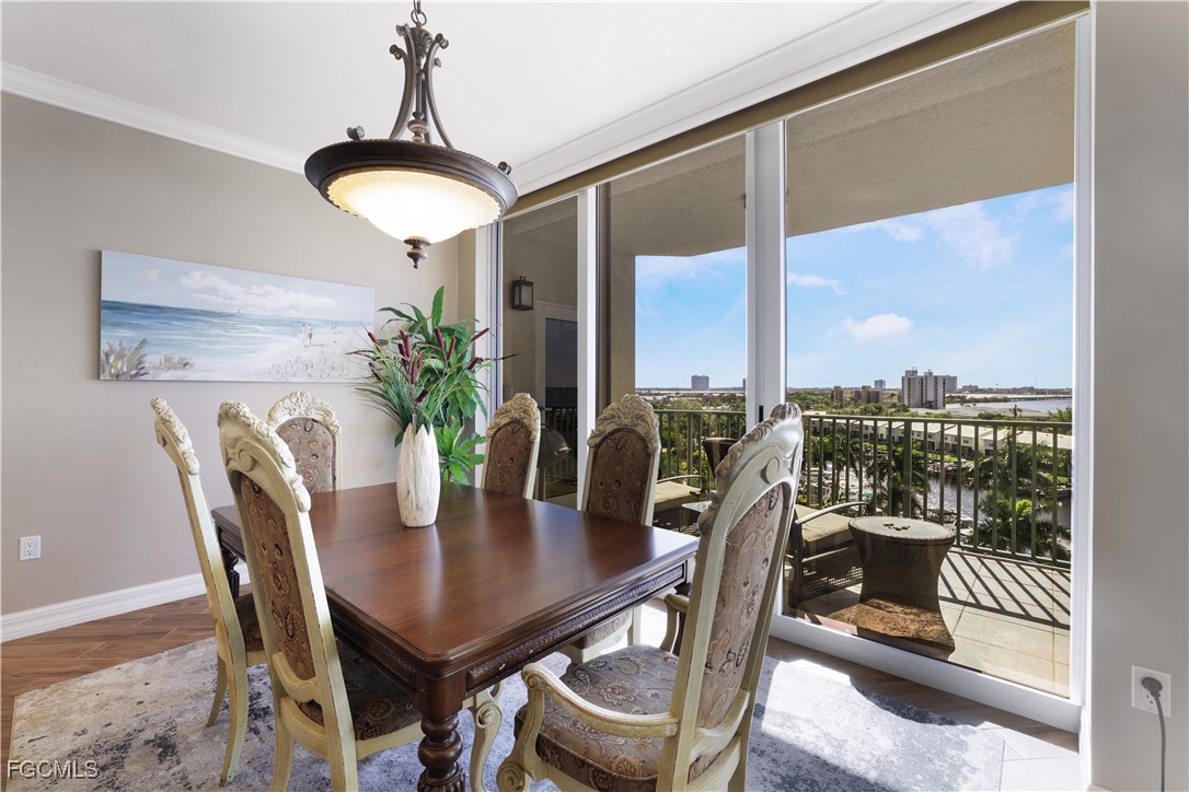 3426 Hancock Bridge Parkway, Unit 704 North Fort Myers, FL 33903 - Photo 11 of 37 a view of a dining room with furniture window and outside view