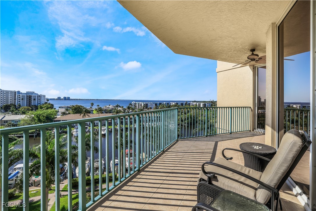 3426 Hancock Bridge Parkway, Unit 704 North Fort Myers, FL 33903 - Photo 13 of 37 a view of balcony with wooden floor and fence