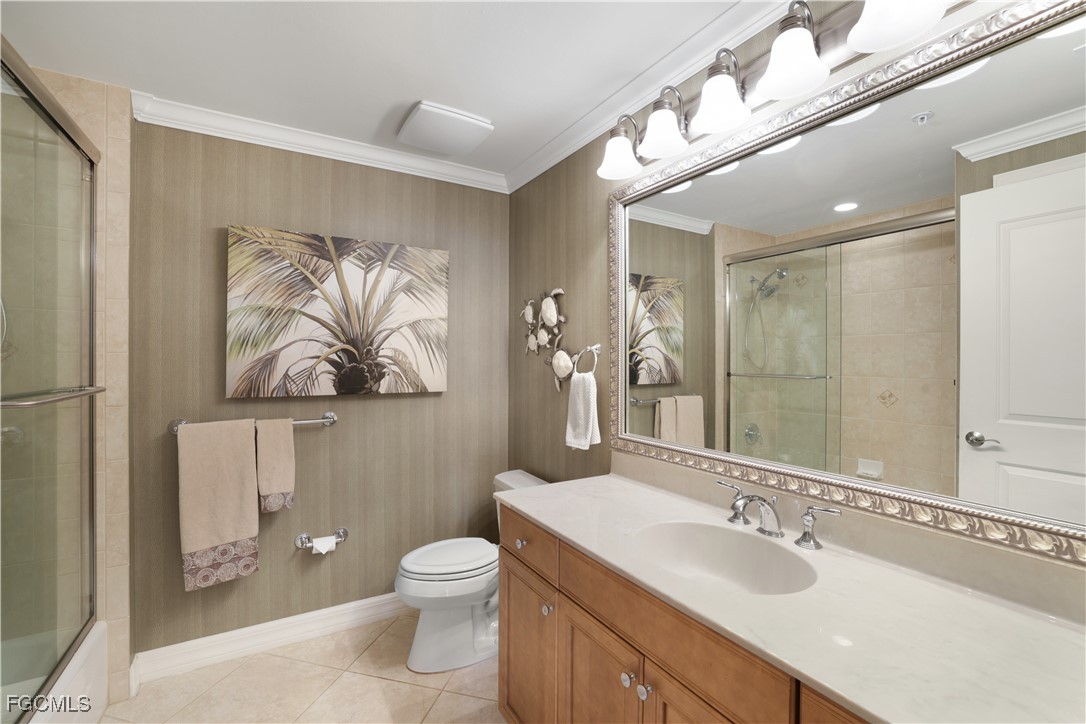 3426 Hancock Bridge Parkway, Unit 704 North Fort Myers, FL 33903 - Photo 18 of 37 a bathroom with a granite countertop toilet a sink and mirror