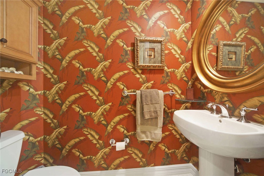 3426 Hancock Bridge Parkway, Unit 704 North Fort Myers, FL 33903 - Photo 20 of 37 a bathroom with a sink and a mirror