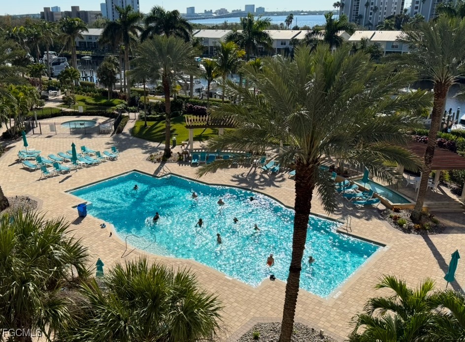 3426 Hancock Bridge Parkway, Unit 704 North Fort Myers, FL 33903 - Photo 3 of 37 a view of a garden with an ocean