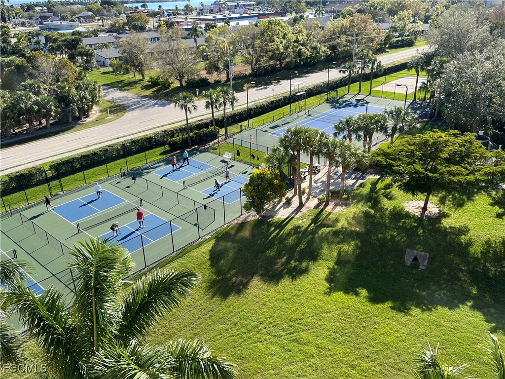 3426 Hancock Bridge Parkway, Unit 704 North Fort Myers, FL 33903 - Photo 35 of 37 an aerial view of residential houses with outdoor space and swimming pool