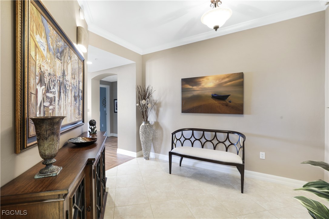 3426 Hancock Bridge Parkway, Unit 704 North Fort Myers, FL 33903 - Photo 4 of 37 a living room with furniture and a flat screen tv