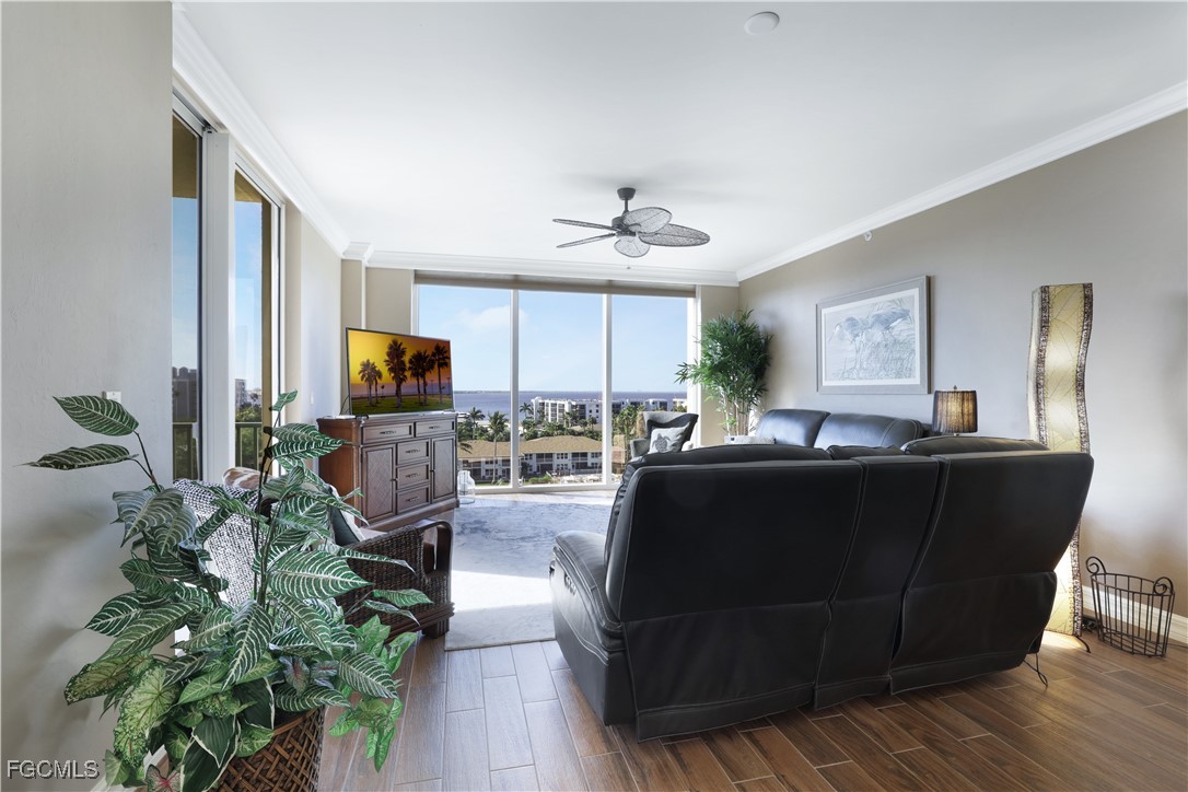 3426 Hancock Bridge Parkway, Unit 704 North Fort Myers, FL 33903 - Photo 5 of 37 a living room with furniture potted plant and a window