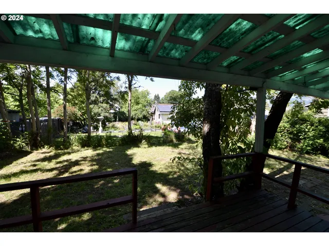 a view of balcony with two chairs and a table