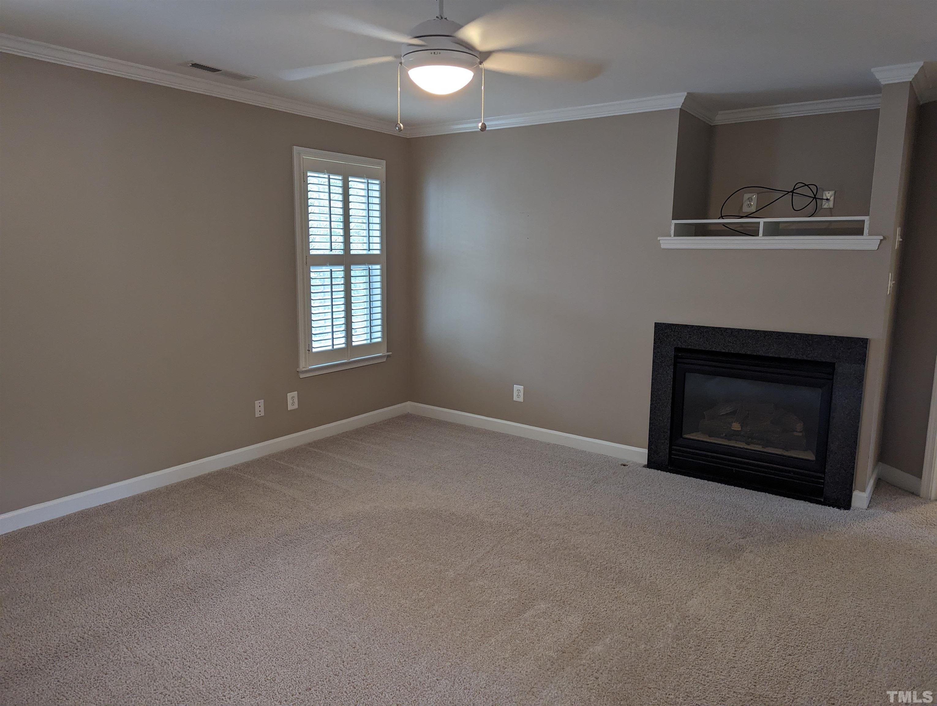 5300 Corinthian Way Raleigh, NC 27607 - Photo 12 of 24 a view of empty room with a fireplace