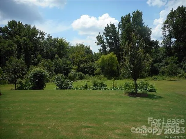 a view of a golf course with a lake