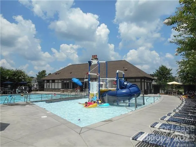 a front view of houses with yard