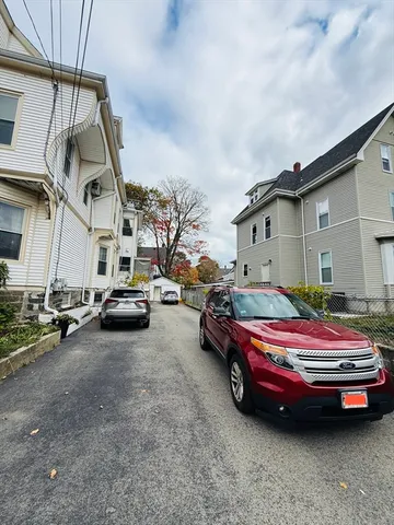 a car parked in front of a house