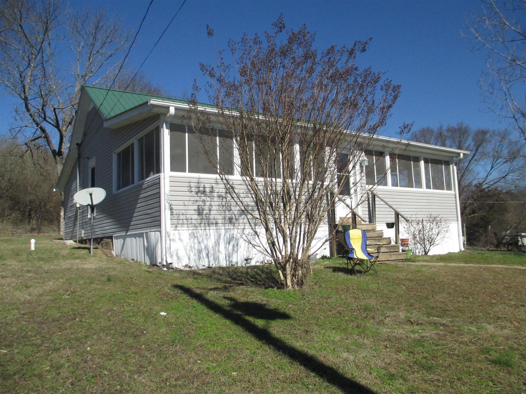 1935 Chicken Road Lebanon, TN 37090 - Photo 1 of 28 a view of a house with backyard and sitting area