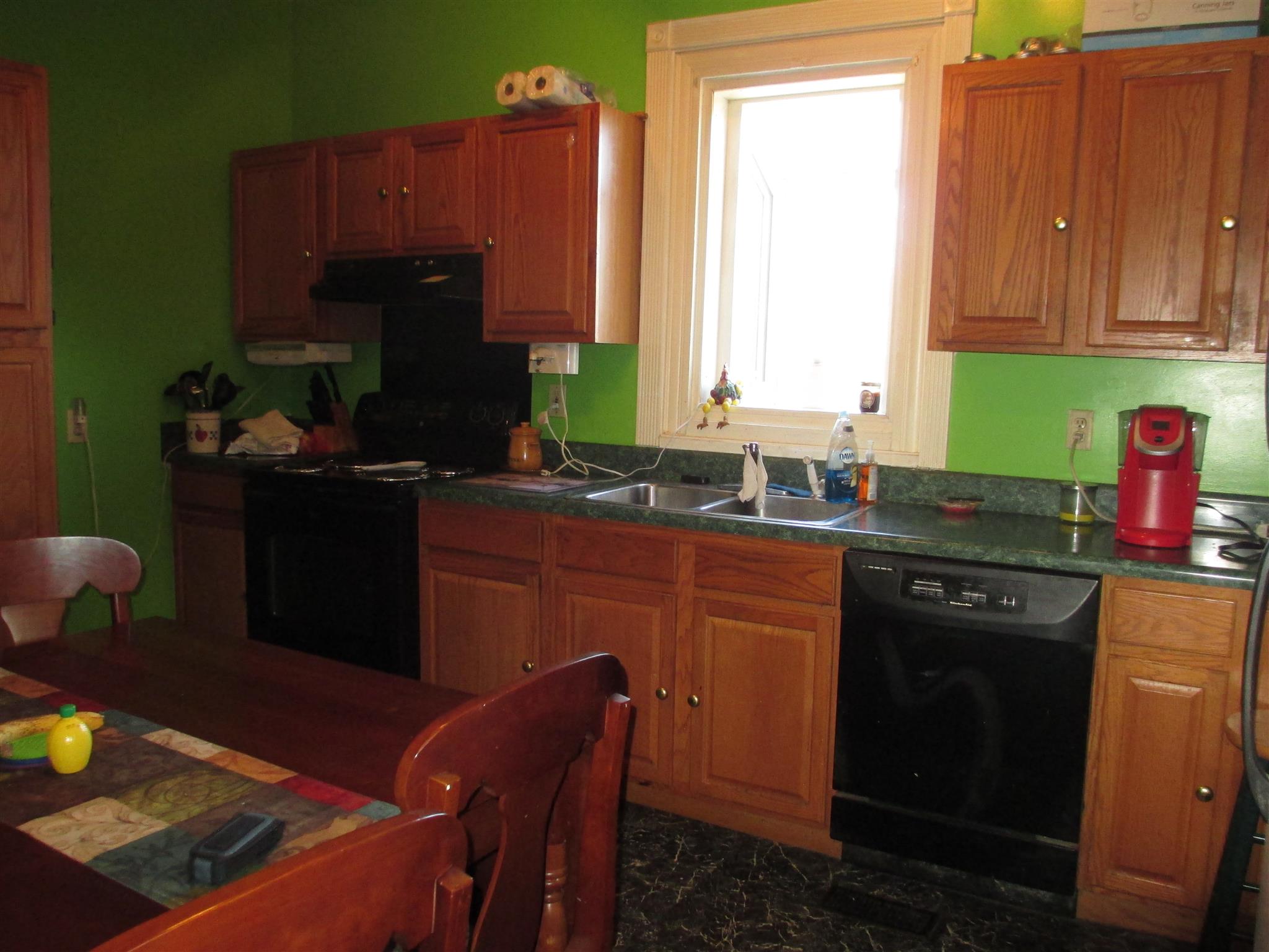 1935 Chicken Road Lebanon, TN 37090 - Photo 11 of 28 a kitchen with stainless steel appliances granite countertop a sink stove and refrigerator