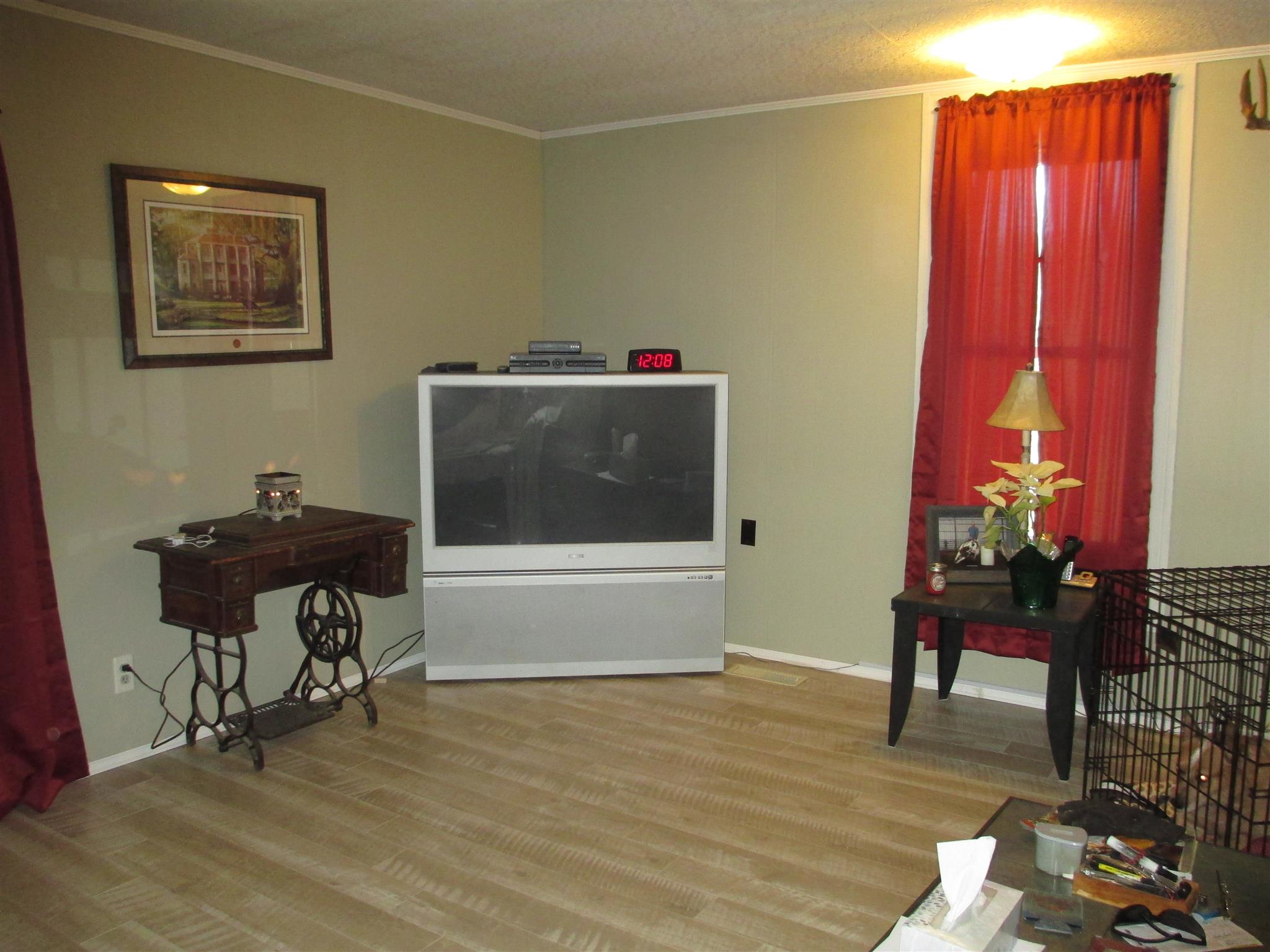 1935 Chicken Road Lebanon, TN 37090 - Photo 7 of 28 a living room with furniture a piano and a bookshelf
